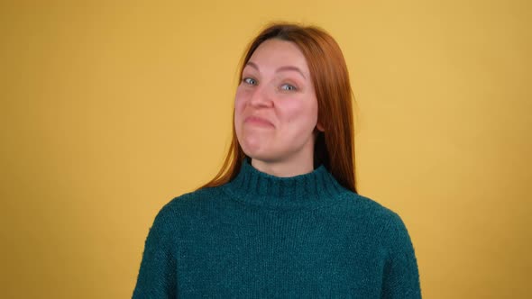 Young Red Hair Woman Posing Isolated on Yellow Color Background Studio