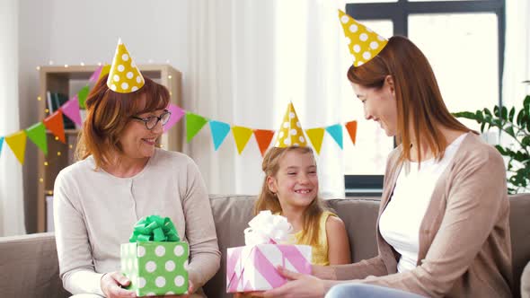 Family Greeting Girl with Birthday at Home Party