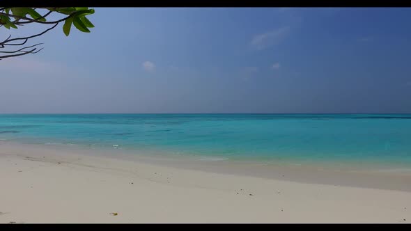 Aerial flying over seascape of beautiful resort beach holiday by aqua blue water and white sandy bac