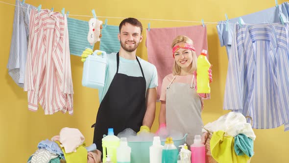 Beautiful Blonde Woman and Handsome Bearded Man Showing Thumb Up and Looking at Camera