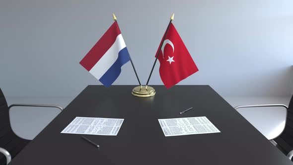 Flags of Netherlands and Turkey and Papers on the Table alt