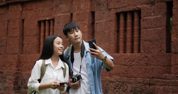 Couple selfie on smartphone in ancient temple