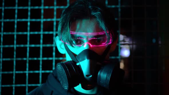 A Young Modern Asian Man in Glowing Digital Magenta Glasses and a Respirator