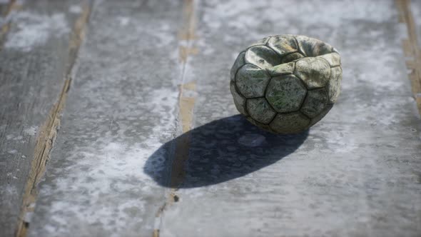 Old Soccer Ball the Cement Floor