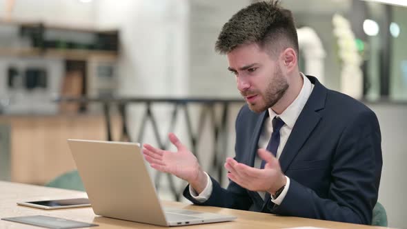 Loss, Young Businessman Reacting To Failure on Laptop in Office 