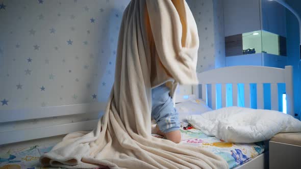 Slow Motion of Little Toddler Boy Hiding Under Blanket and Jumping Out