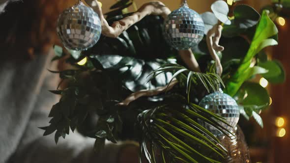 Girl Hangs a Christmas Decoration