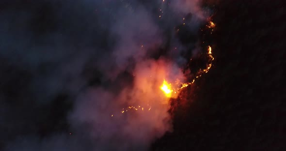 Aerial Panoramic View of a Forest Fire at Night Heavy Smoke Causes Air Pollution and Fire in Full