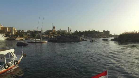 Boats on the Nile river in Aswan at sunset