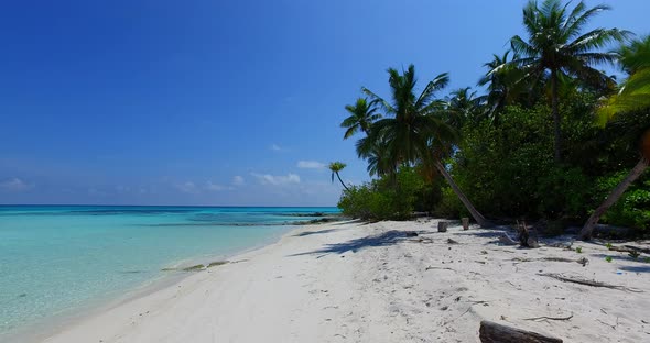 Tropical drone copy space shot of a white paradise beach and blue water background in hi res 4K