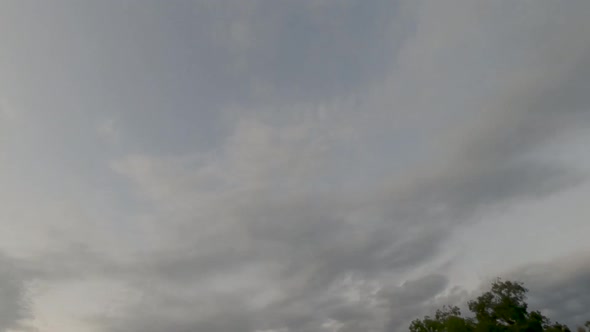 Night lapse of clouds and stars during a rainy night alt