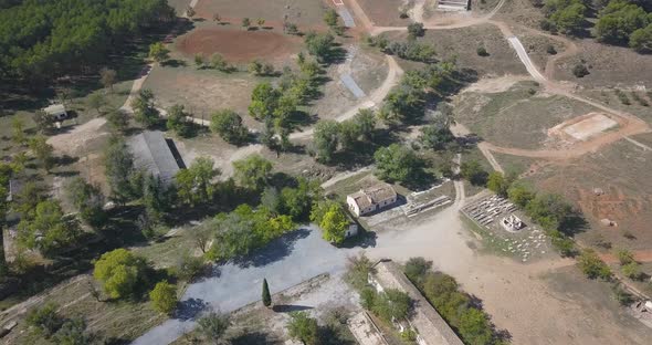 Aerial view of old army facilities with barracks and a firing range abandoned.