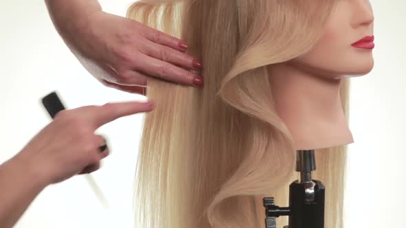 Wave of Hair on the Dummy. Hair on His Head Turned in Profile. White. Close Up