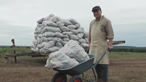 Farm Worker With Potatoes