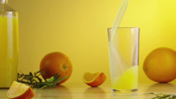 Freshly Squeezed Sweet Orange Juice is Poured Into Glass