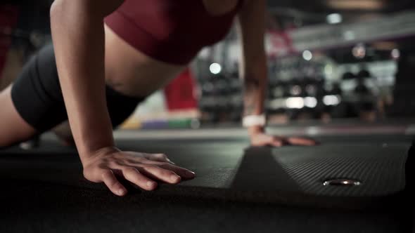 Strong Athletic Woman Doing Push Ups at the Gym in Slow Motion