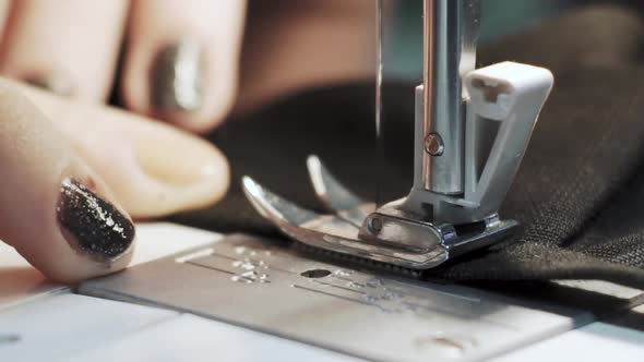 Close Up Shot of Female Hands Working on Sewing Machine