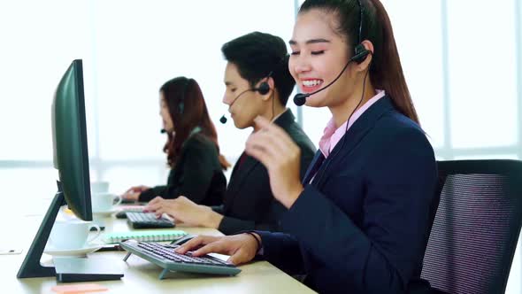 Business People Wearing Headset Working in Office