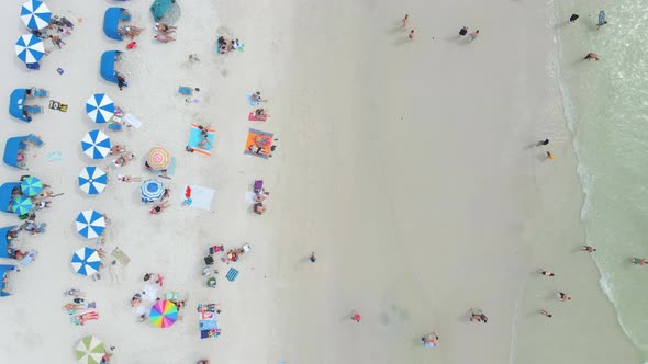 Top down view of people in a white sand beautiful beach in Clearwater, Florida