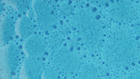 Blue Colored Liquid Ink Bubling and Floating Background Texture