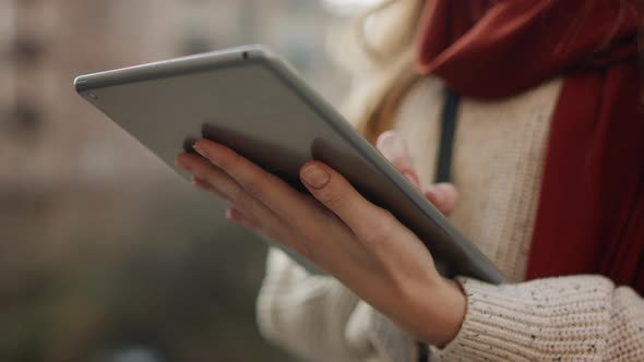 Closeup Woman Hands Serfing Internet on Tablet Computer Outdoors