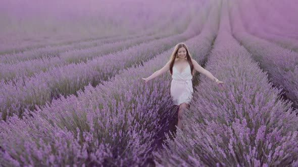 Woman Among Lavender at Sunset