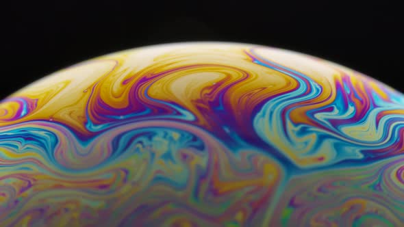 Psychedelic Abstract Planet From Soap Bubble on Black Background
