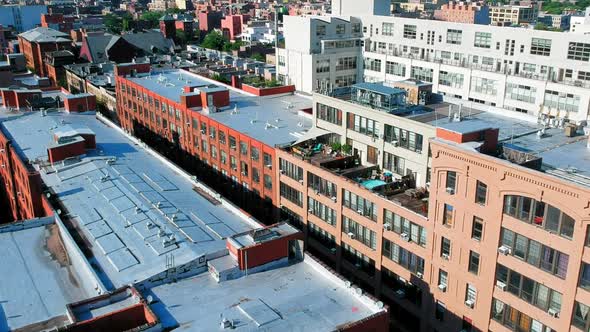 Large apartment buildings in Brooklyn, NYC across from Manhattan, panning shot