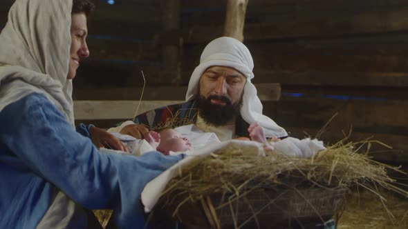 Mary and Joseph Admiring Baby Jesus