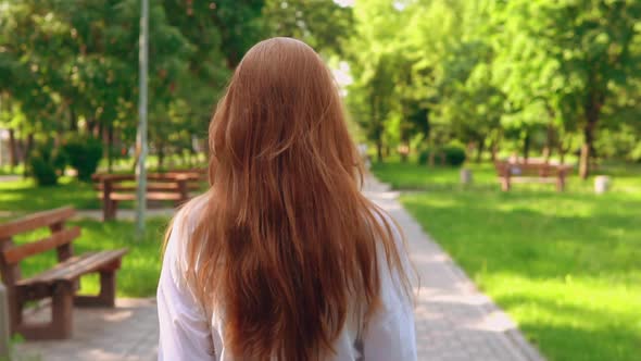 Woman with Beautiful Long Hair Turn Face To the Camera