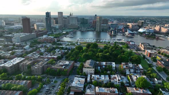 Federal Hill in South Baltimore. Aerial view of Inner Harbor at sunset. Dramatic golden hour light.