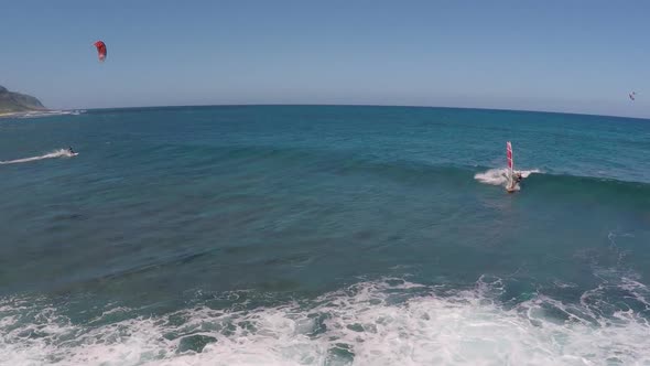 Aerial view of a man windsurfing in Hawaii