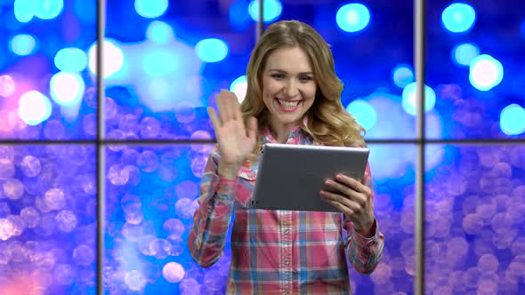 Young Woman Using Pad for Video Chatting