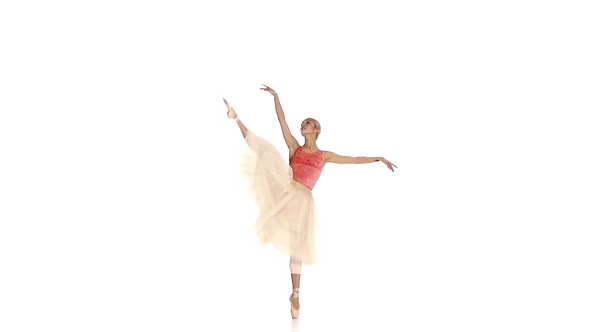 Pretty Ballerina Making Dance Trick, Grands Battements, on White Background, Slow Motion