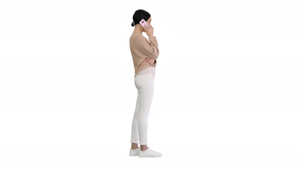 Emotional Smiling Young Woman Talking on the Phone and Gesturing on White Background