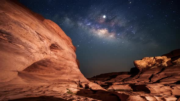 4K Motion Time lapse of milky way and sunrise over Sam Pan Bok canyon, Ubon ratchathani, Thailand 