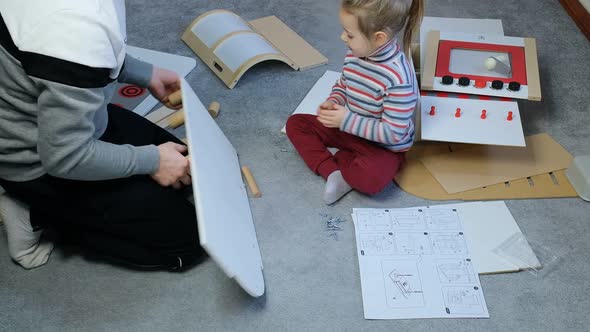 Toddler Daughter Help Father to Assembly Play Kraft Kitchens Wood Kraft