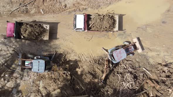 Aerial truck clear the debris and mud