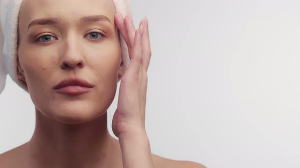 Closeup Beautiful Clean Face Woman After Spa Reception Runs Finger Contour of Head Front View