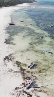 Vertical Video Boats in the Ocean Near the Coast of Zanzibar Tanzania