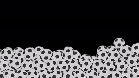 Soccer Balls Roll From Left and Fill Lower Third of Screen