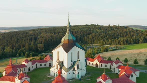 Flying Above the Pilgrimage Church of Saint John of Nepomuk on the Green Hill at Sunset