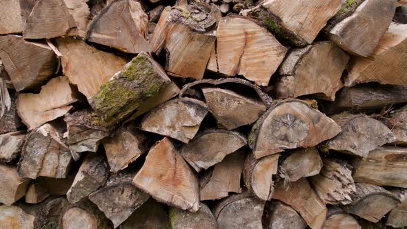 A neatly stacked pile of split wood.