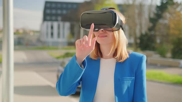 Business Woman Wearing Professional Virtual Reality Headset and Gestures in Augmented Reality