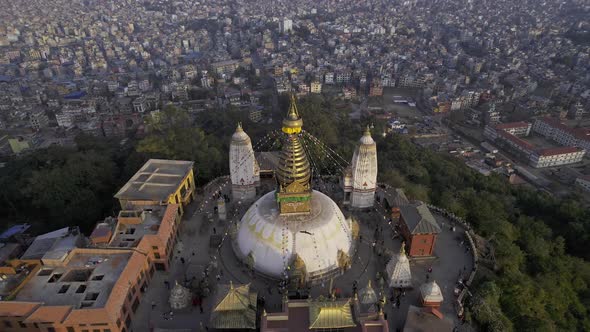 Flying backwards tilting down towards Swayambhunath Stupa