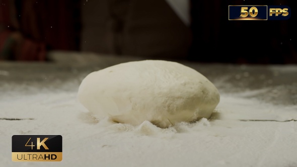 Chef Baker Man in Apron Prepares the Dough