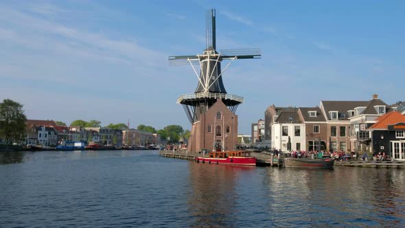 Harlem Landmark Windmill De Adriaan on Spaarne River. Harlem, Netherlands