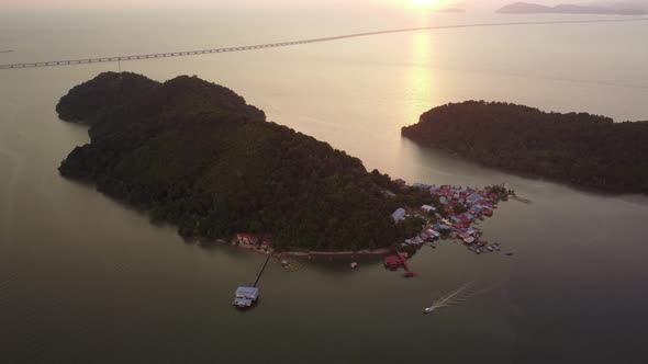 Aerial view a boat move at Pulau Aman in sunset hour