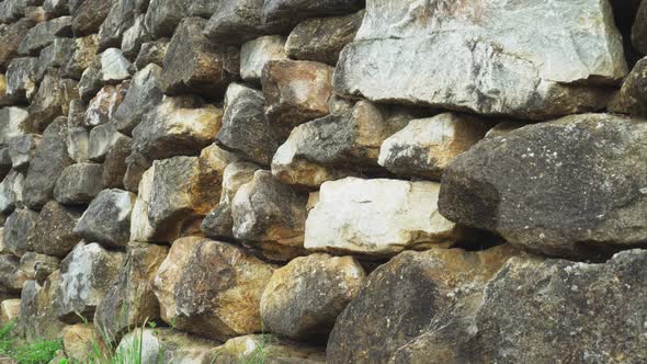 Stone wall made of natural hard stone. 