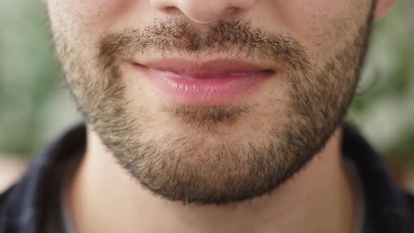 Wide Male Smile Teeth with Braces Closeup